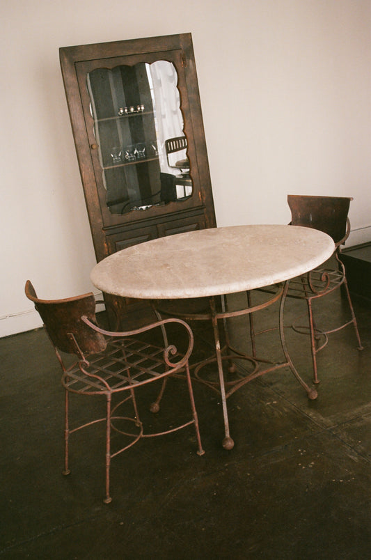 Round Cream Travertine Dining Table with Metal Base